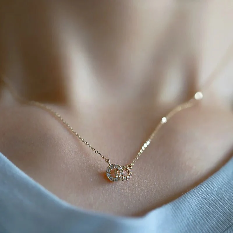 Collar Metiseko de plata de ley 925 con doble cruz y círculos de circonitas cúbicas transparentes