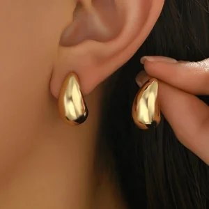 SHEIN 1 par de pendientes de botón ovalados sencillos y modernos para mujer, clásicos