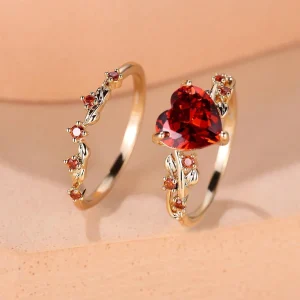 SHEIN Vanel Set de 2 anillos con garra incrustada con corazón rojo y zirconia